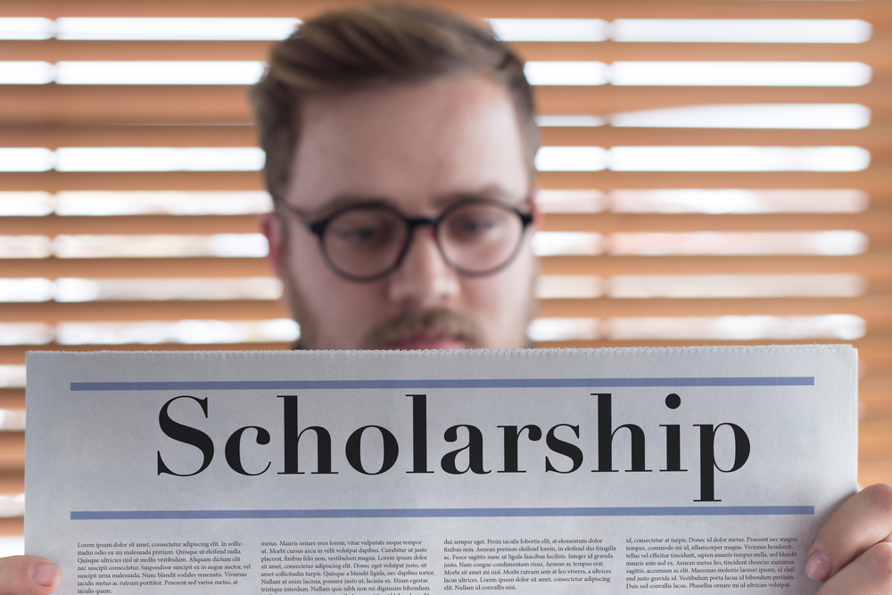 Man,Reading,Scholarship,Headlined,Newspaper