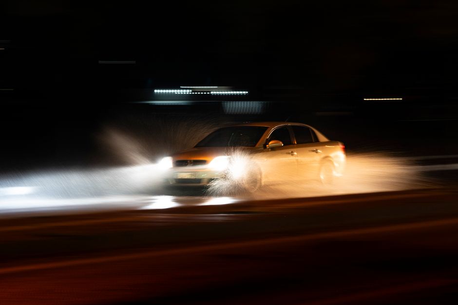 car driving on dark Opelousas road at night